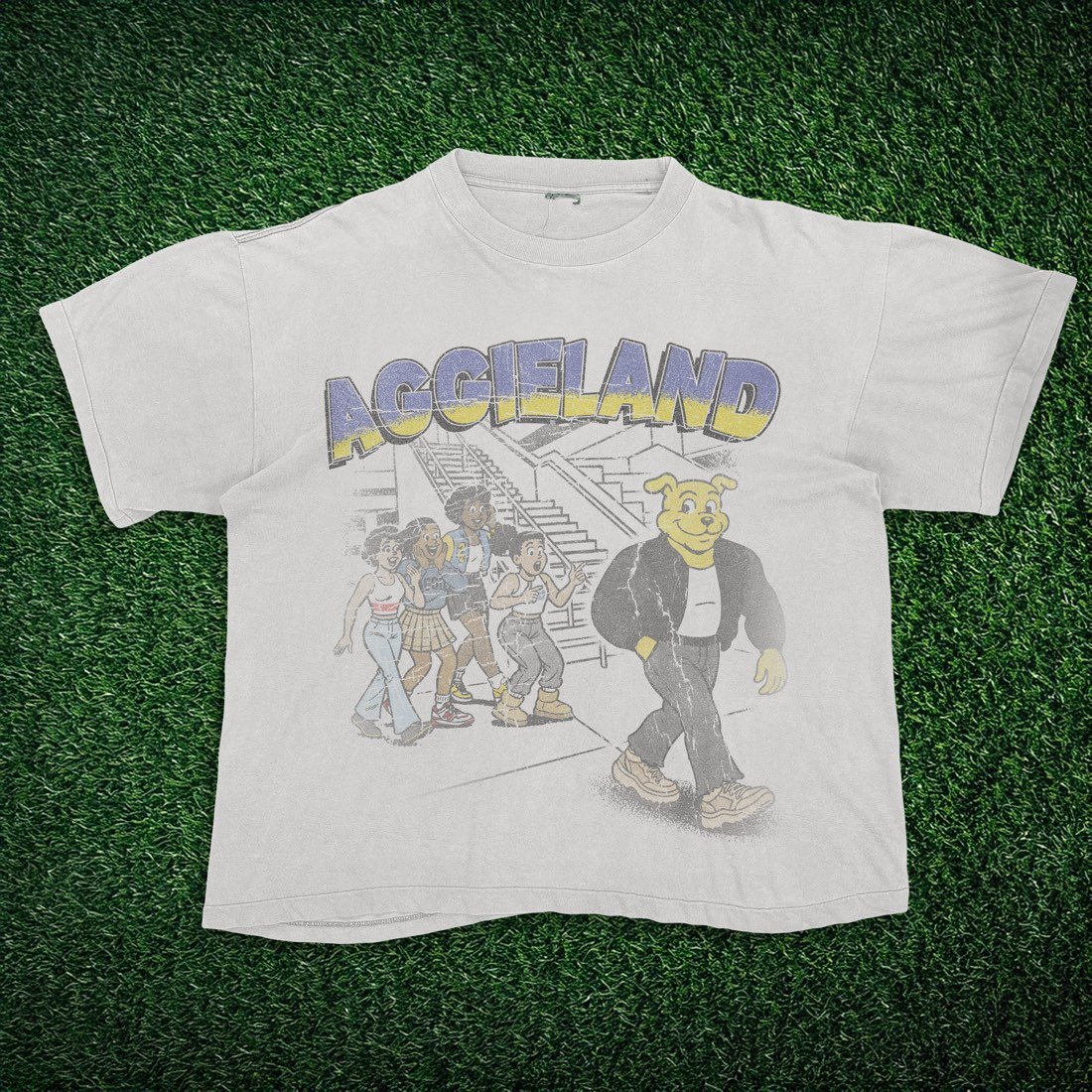 White tee with an Aggieland graphic