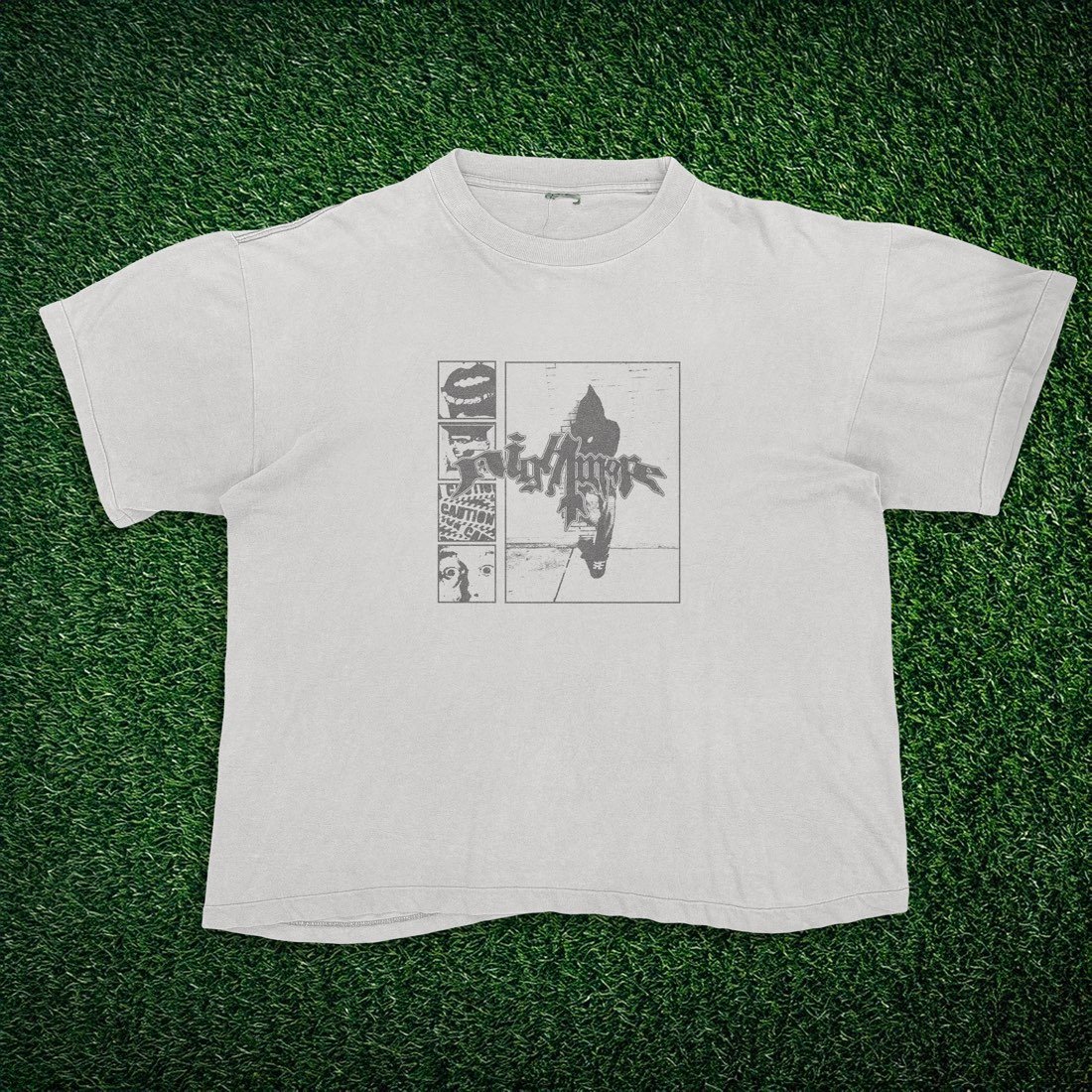 White tee with a nightmare-themed collage graphic and gothic type